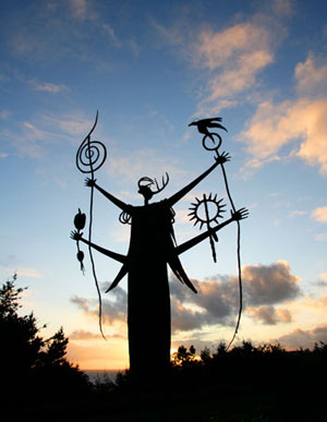 Photo of sculpture silhouetted agains sunset